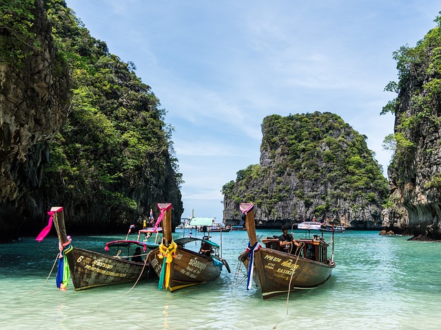 Phuket showing beach and 3 boats